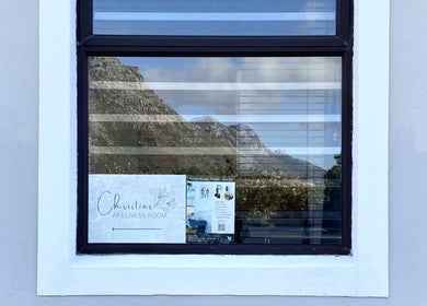 Reflection of mountains in window at Christie's Wellness Room - Medical Massage Therapy, Cape Town, Western Cape, ZA.