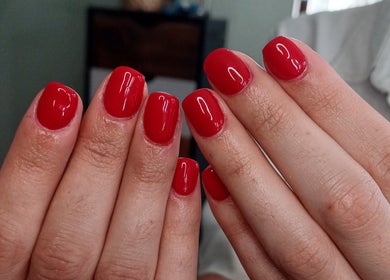 Red manicured nails at The Look Hair & Nail Salon in Vredendal, Western Cape, ZA.