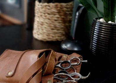 Leather pouch with hair scissors at The Look Hair & Nail Salon, Vredendal, Western Cape, ZA.