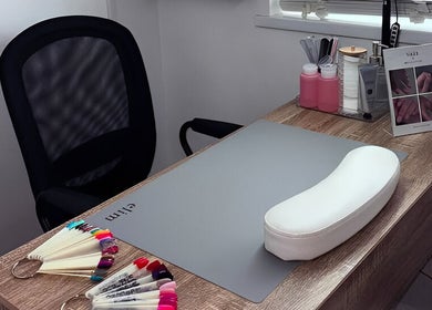 Nail station at Studio 59, Rumney, Wales, GB with tools and polish samples for a perfect manicure.