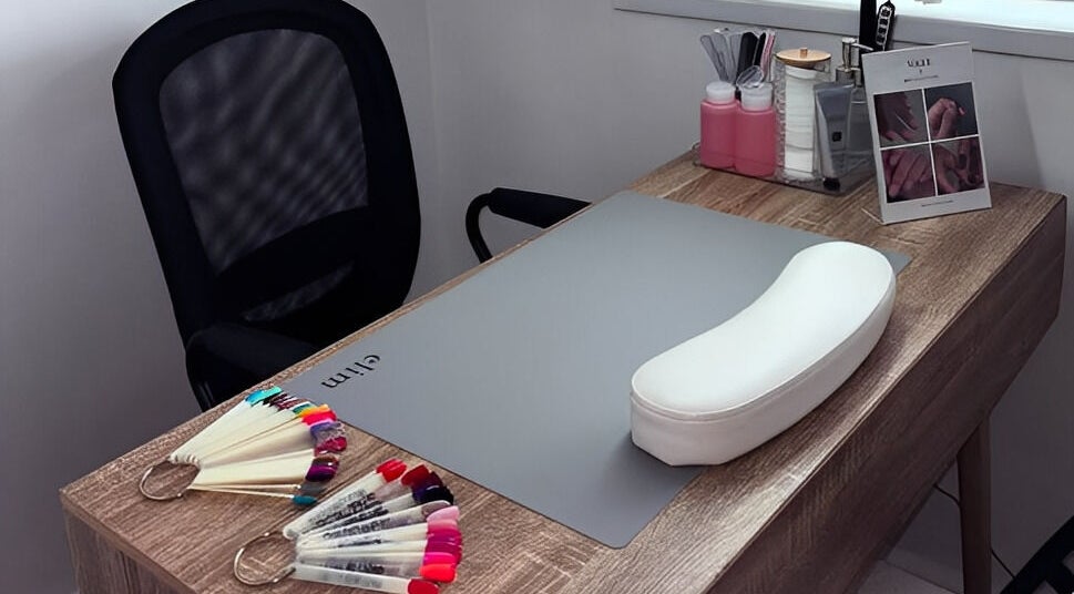 Nail art setup at Studio 59 Pro Cosmetology, Microblading & Body Piercing, Rumney, Wales, GB, showcasing tools and a desk.