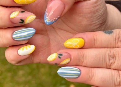 Vibrant citrus-themed nail art at Abigail’s, Darlington, England, GB. Blue, yellow, and lemon designs.