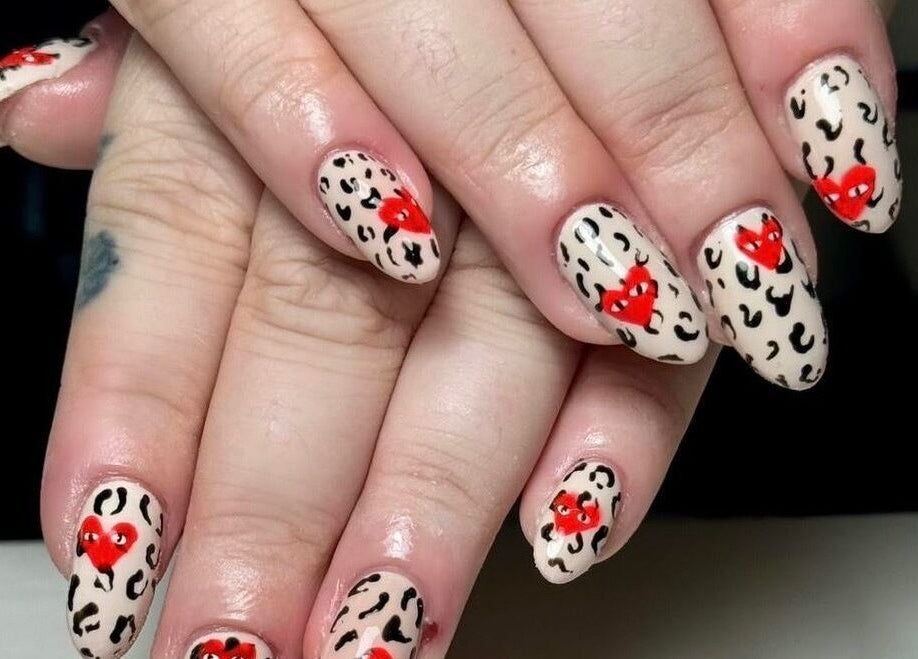 Leopard print nails with red hearts design at Abigail’s in Darlington, England, GB.