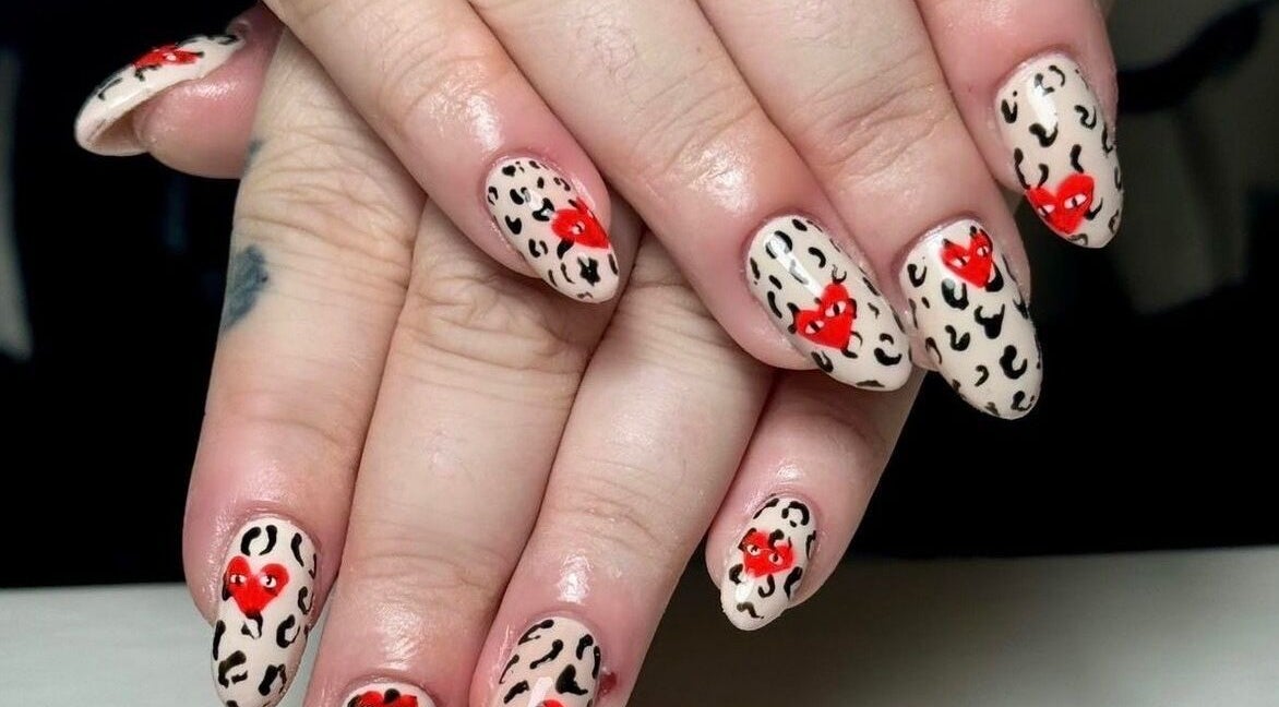 Leopard print nails with red hearts design at Abigail’s in Darlington, England, GB.