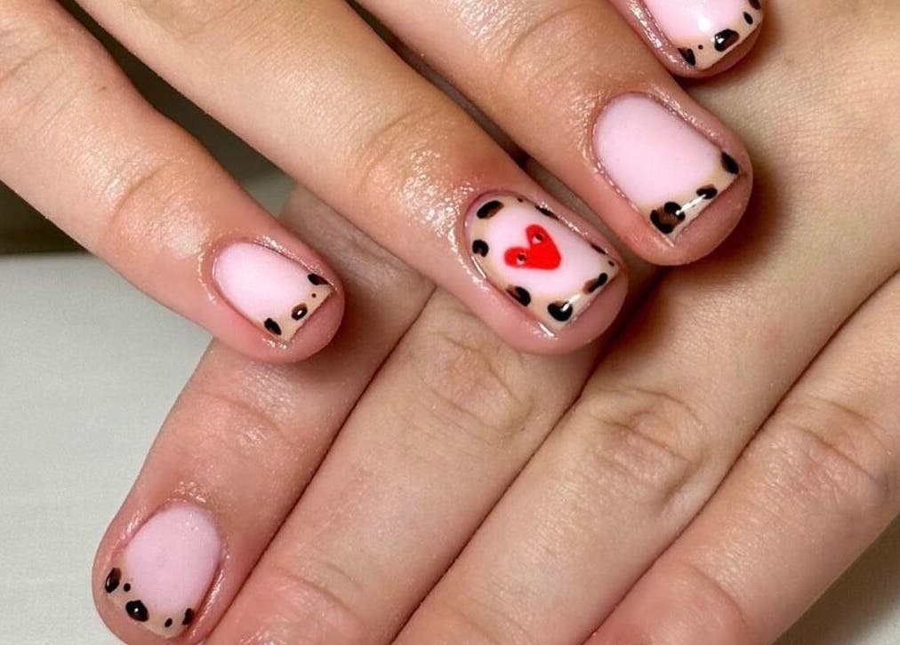 Stylish nail design featuring hearts and dots at Abigail’s, Darlington, England, GB.