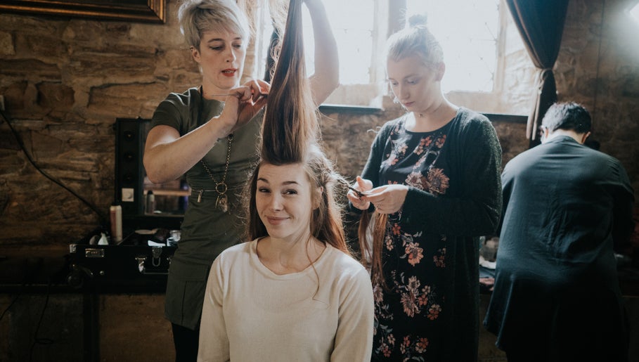 Stylists creating elegant hairstyle at Cass at Marina Drive, Shell Cove, New South Wales, AU.