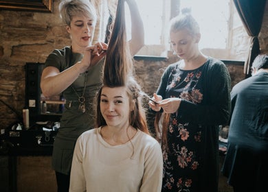 Stylists creating elegant hairstyle at Cass at Marina Drive, Shell Cove, New South Wales, AU.