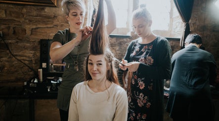 Stylists creating elegant hairstyle at Cass at Marina Drive, Shell Cove, New South Wales, AU.