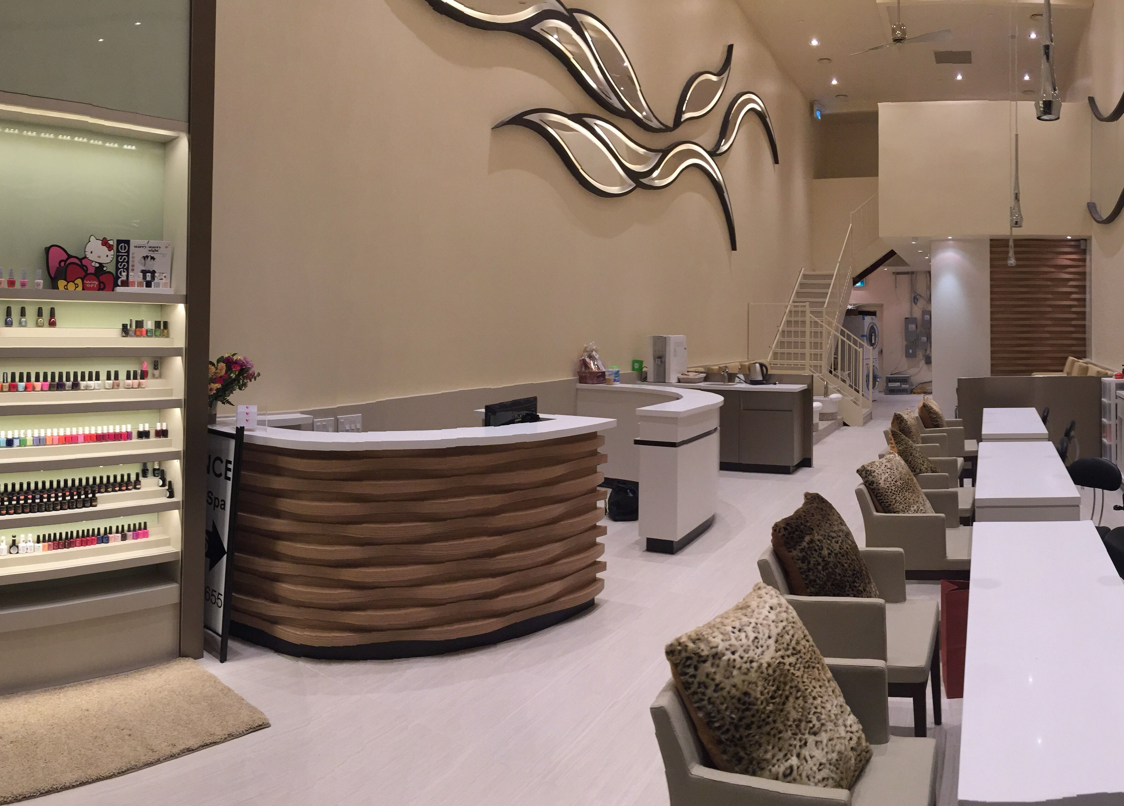 Elegant interior of Essence Nails & Spa, Vaughan, Ontario, CA featuring manicure station and stylish decor.