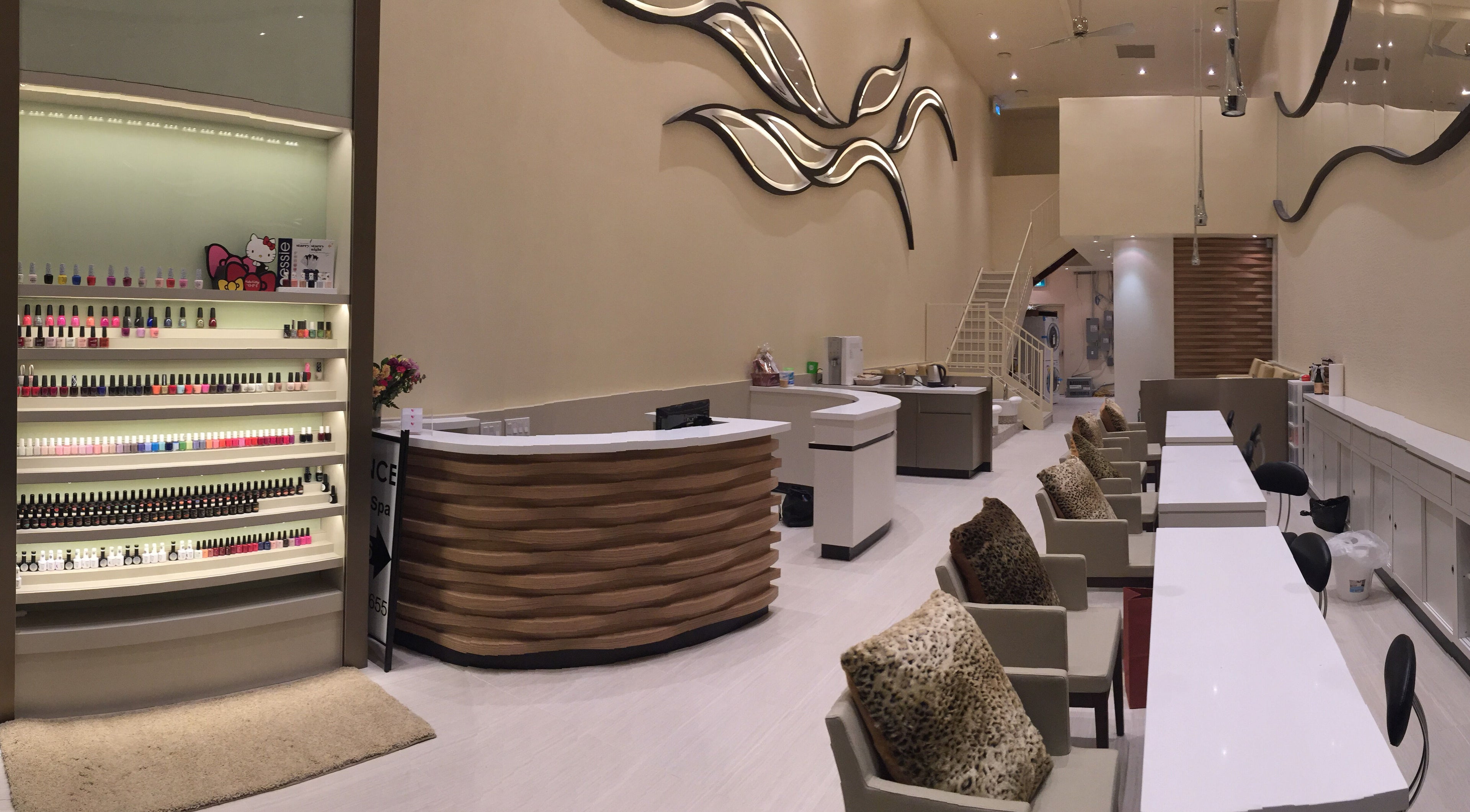Elegant interior of Essence Nails & Spa, Vaughan, Ontario, CA featuring manicure station and stylish decor.