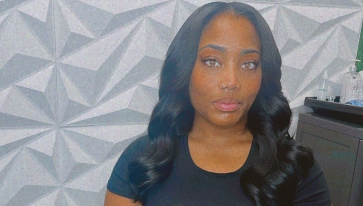 A stylish visitor at The T Pearl Collection in Wilmington, Delaware, US showcases elegant hair styling.