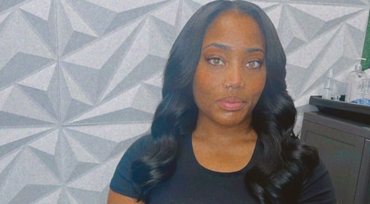 A stylish visitor at The T Pearl Collection in Wilmington, Delaware, US showcases elegant hair styling.