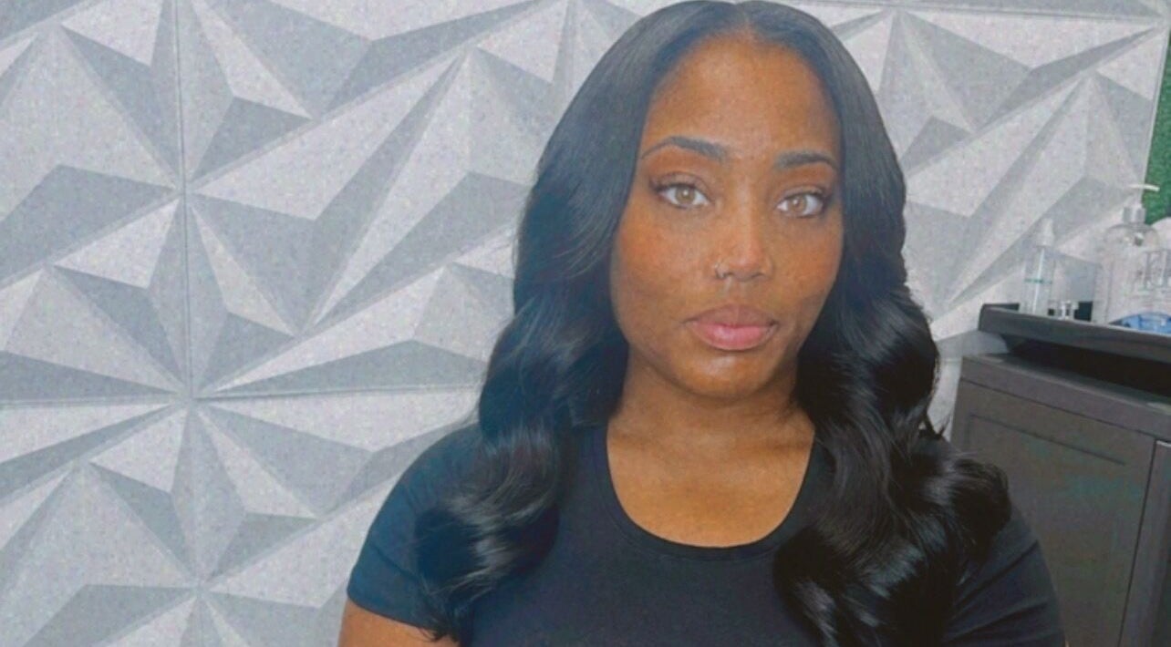 A stylish visitor at The T Pearl Collection in Wilmington, Delaware, US showcases elegant hair styling.