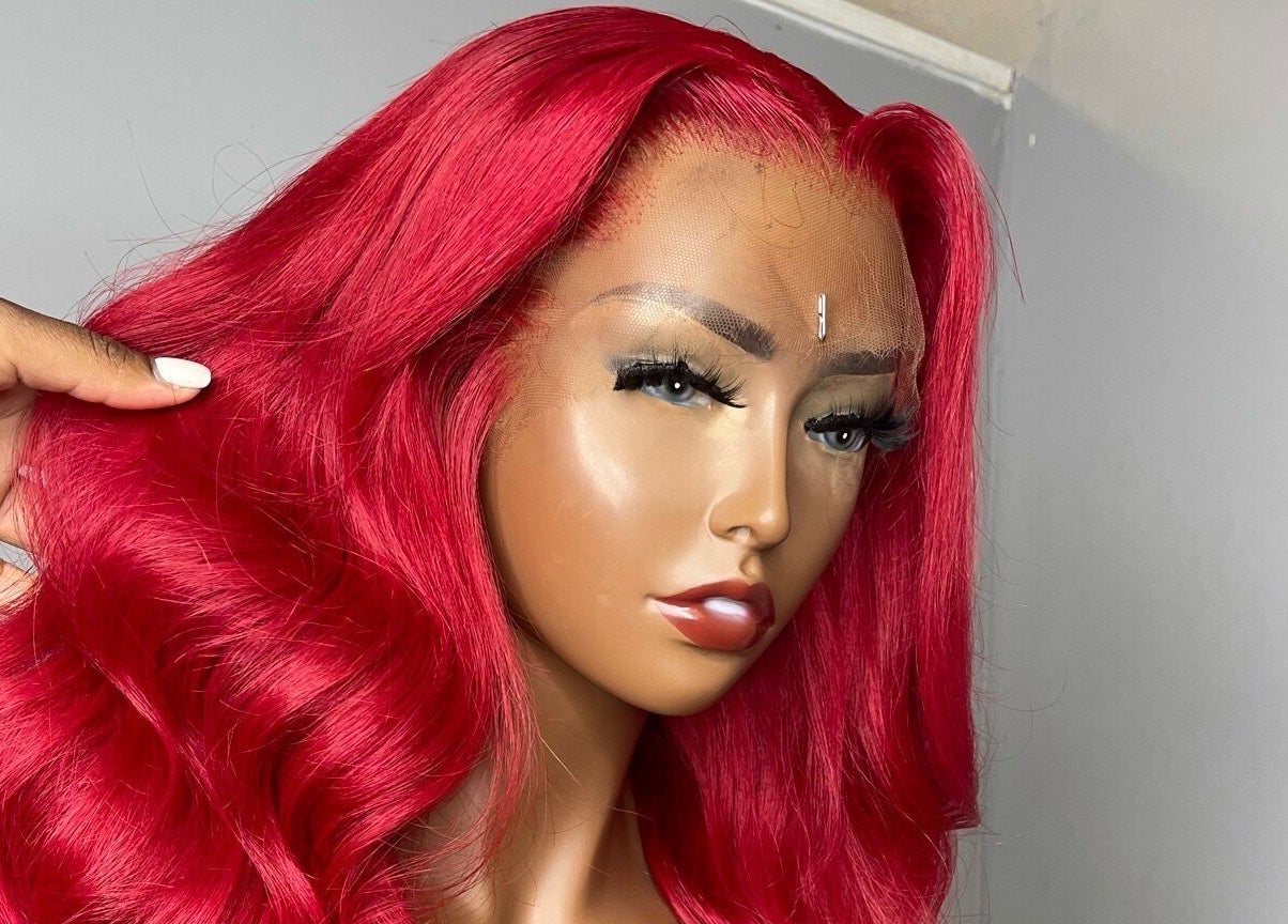 Vibrant red wig showcased at The T Pearl Collection, Wilmington, Delaware, US.