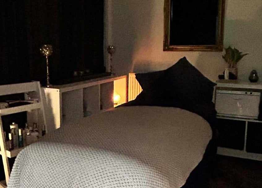 Cozy treatment room at Abbey Mill, Paisley, Scotland, GB with ambient lighting and spa bed.