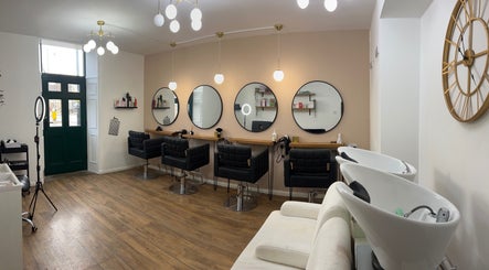 Stylish interior of R&co Hair Boutique in Market Deeping, England, GB with modern decor and hair styling stations.