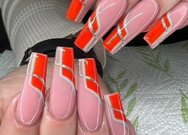 Bold red and pink manicured nails at Nails by Sam Potch, Potchefstroom, South Africa, ZA.