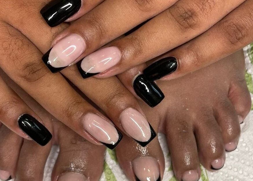 Elegantly crafted French nails with black tips at Nails by Sam Potch, Potchefstroom, South Africa, ZA.