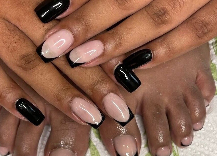 Elegantly crafted French nails with black tips at Nails by Sam Potch, Potchefstroom, South Africa, ZA.
