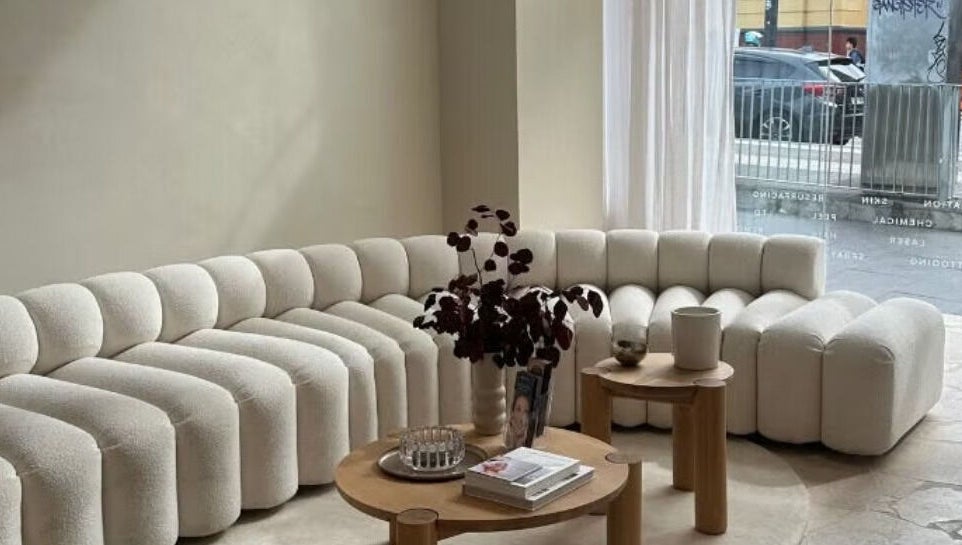 Cozy corner seating in Shape House X AKME Pop Up, Melbourne, Victoria, AU with plush sofa and decor.