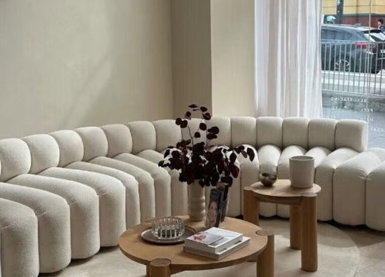 Cozy corner seating in Shape House X AKME Pop Up, Melbourne, Victoria, AU with plush sofa and decor.