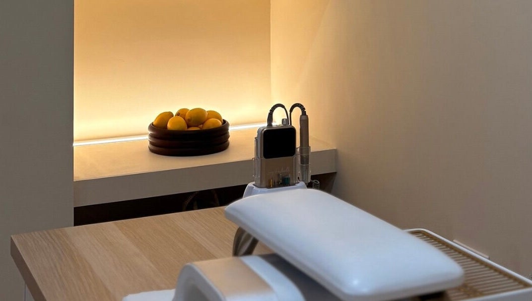Serene treatment room at By Jasmine Rose P, Longwell Green, England, GB with cozy lighting and modern equipment.