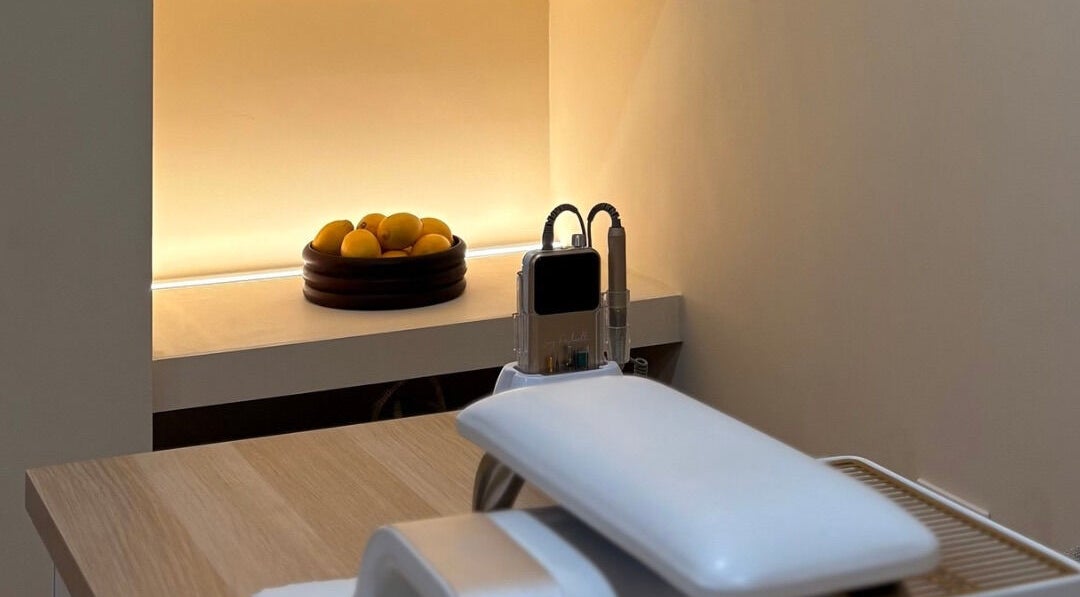Serene treatment room at By Jasmine Rose P, Longwell Green, England, GB with cozy lighting and modern equipment.