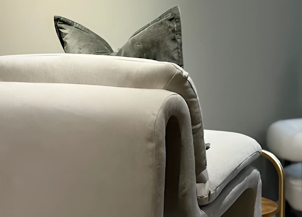 Elegant chair with plush cushions at By Jasmine Rose P, Longwell Green, England, GB. Perfect for relaxation.