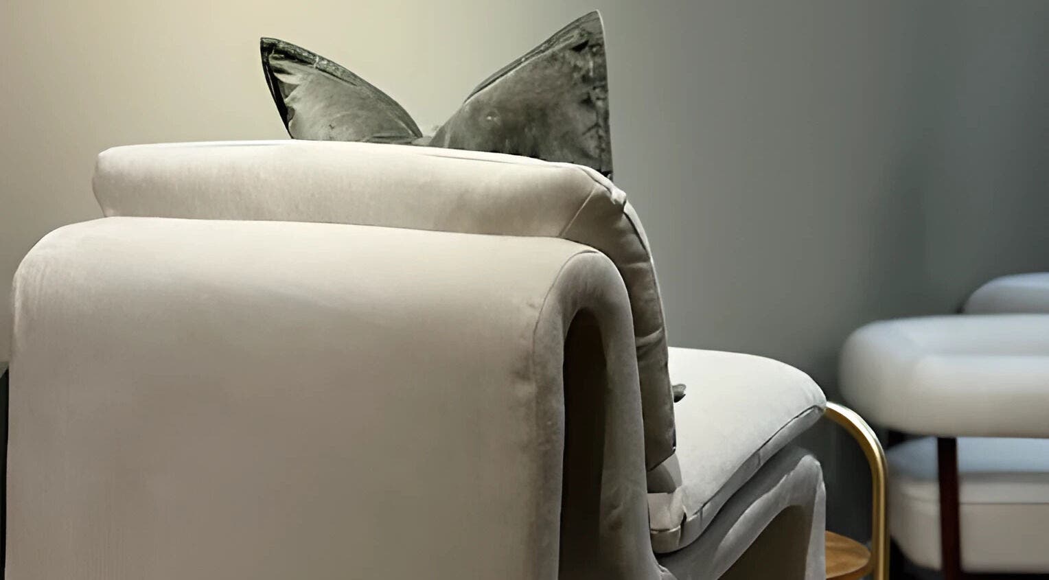 Elegant chair with plush cushions at By Jasmine Rose P, Longwell Green, England, GB. Perfect for relaxation.