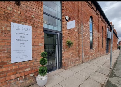 Chic brick façade of Aesthetics by Hannah in Gainsborough, England, GB featuring modern glass doors.