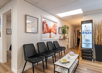 Inviting lobby at Wellness Privé Massothérapie & Bien-Être, Montreal, Quebec, CA with seating and calming decor.