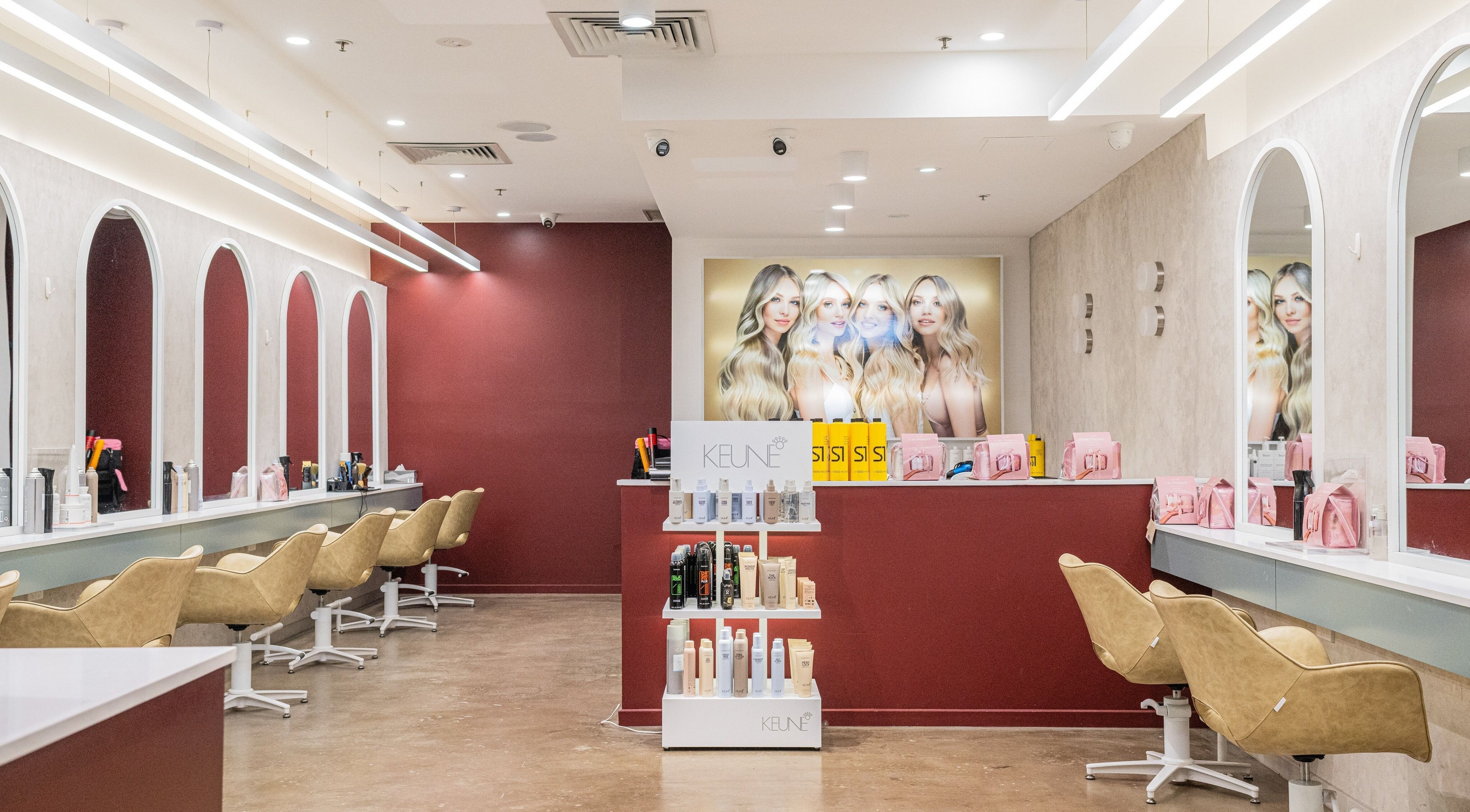 Elegant salon interior at W Hair Bar - Emu Plains, New South Wales, AU with styling chairs and product display.