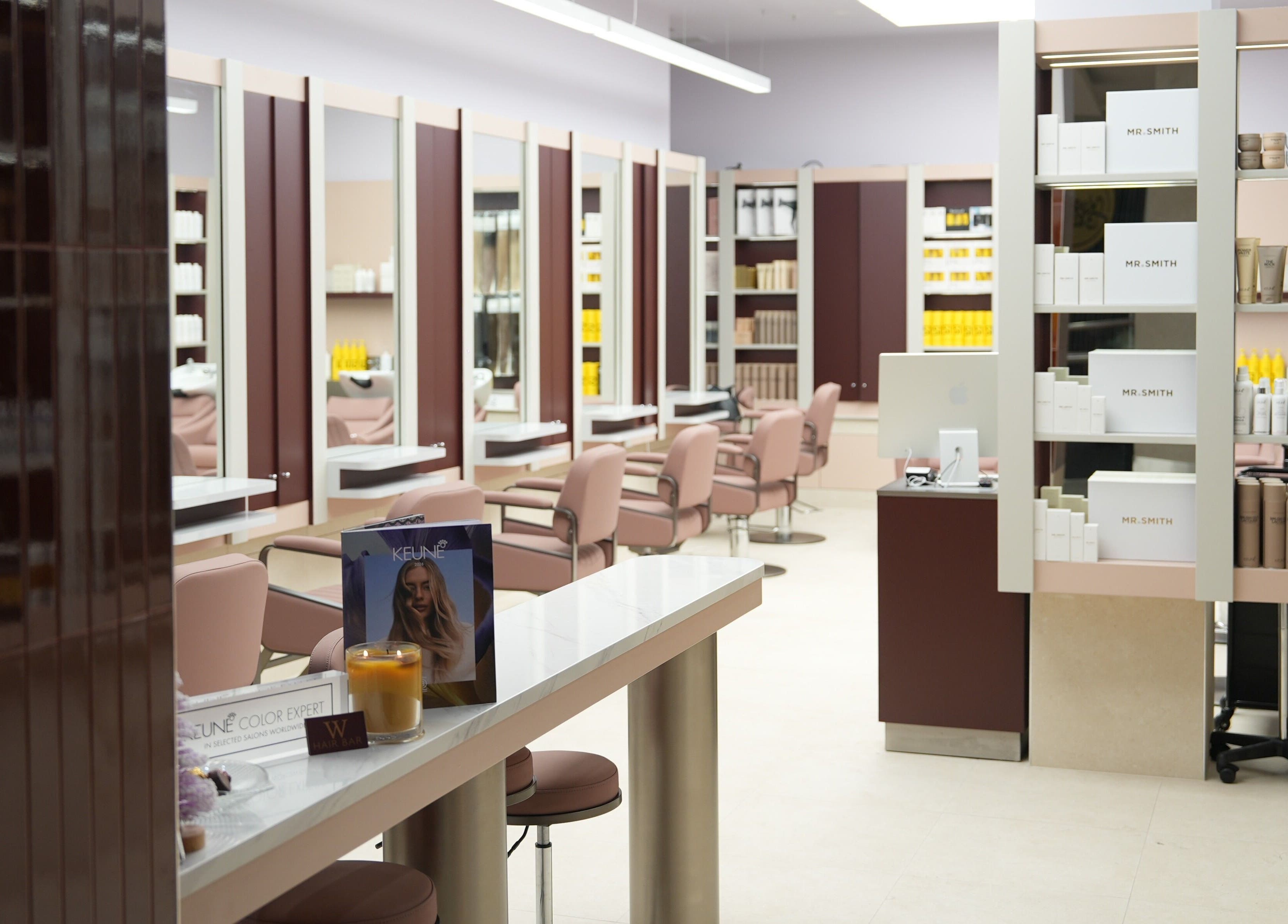 Elegant interior of W Hair Bar - East Garden, Eastgardens, New South Wales, AU with modern styling stations.