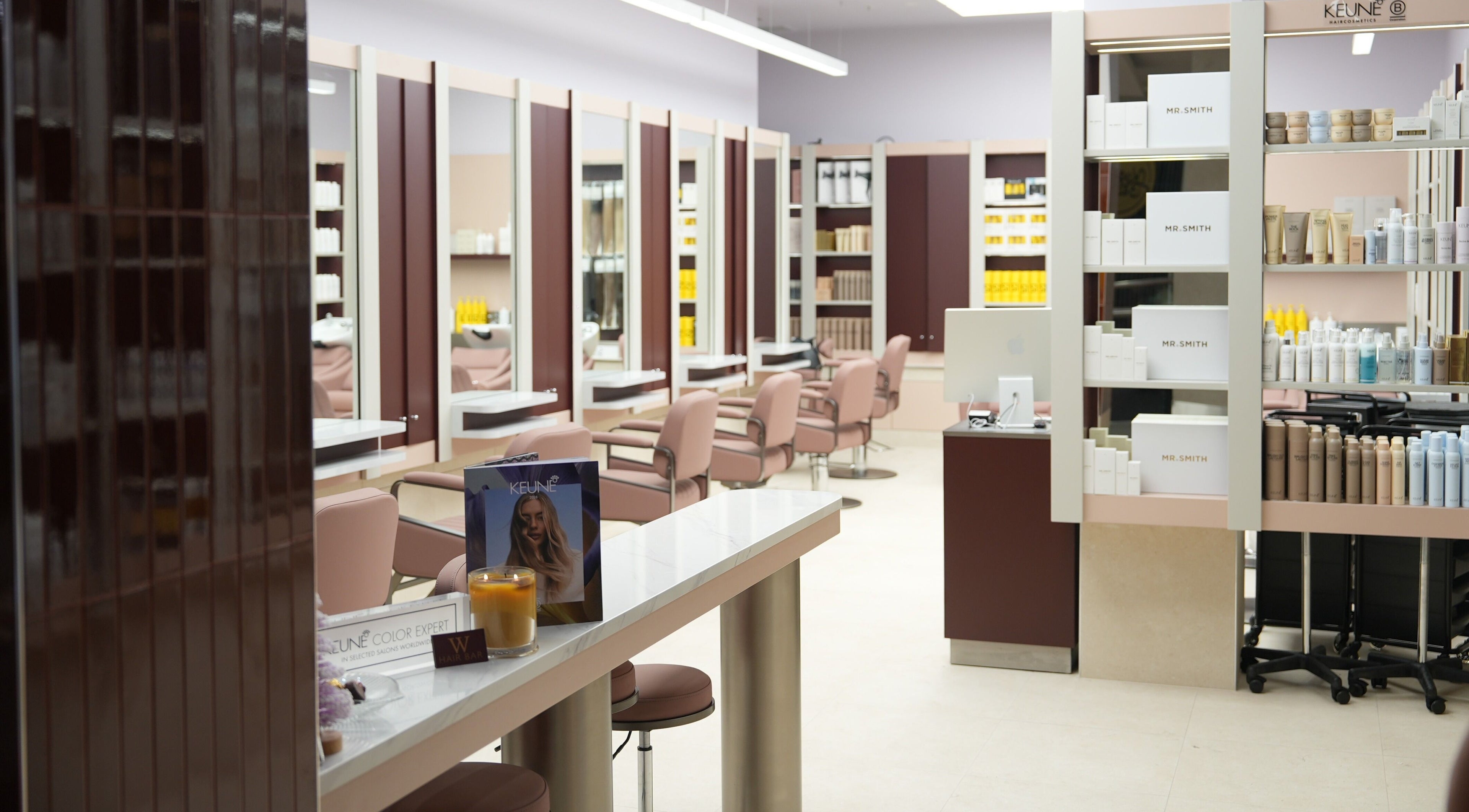 Elegant interior of W Hair Bar - East Garden, Eastgardens, New South Wales, AU with modern styling stations.