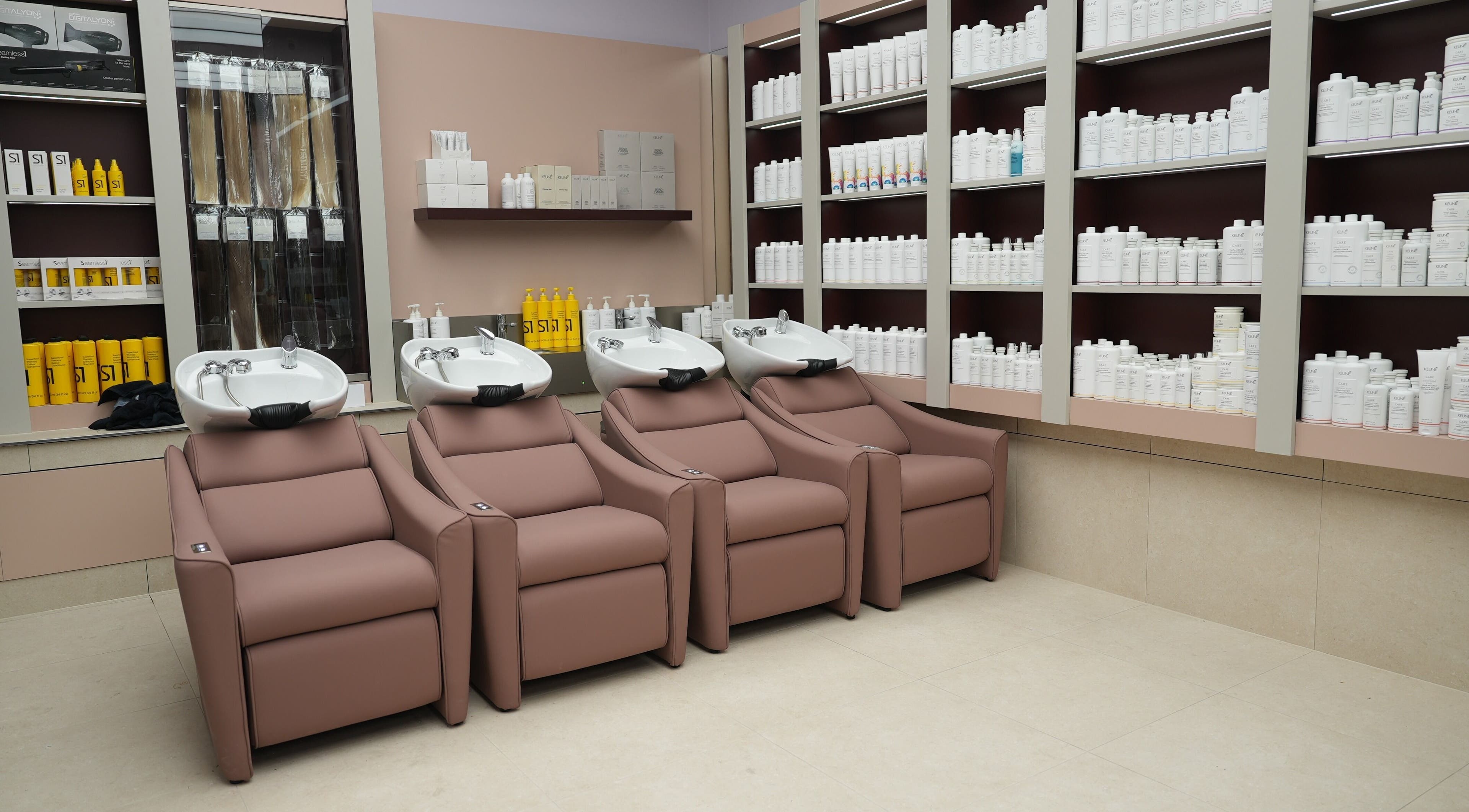 Luxury wash station at W Hair Bar, Eastgardens, New South Wales, AU surrounded by product shelves.