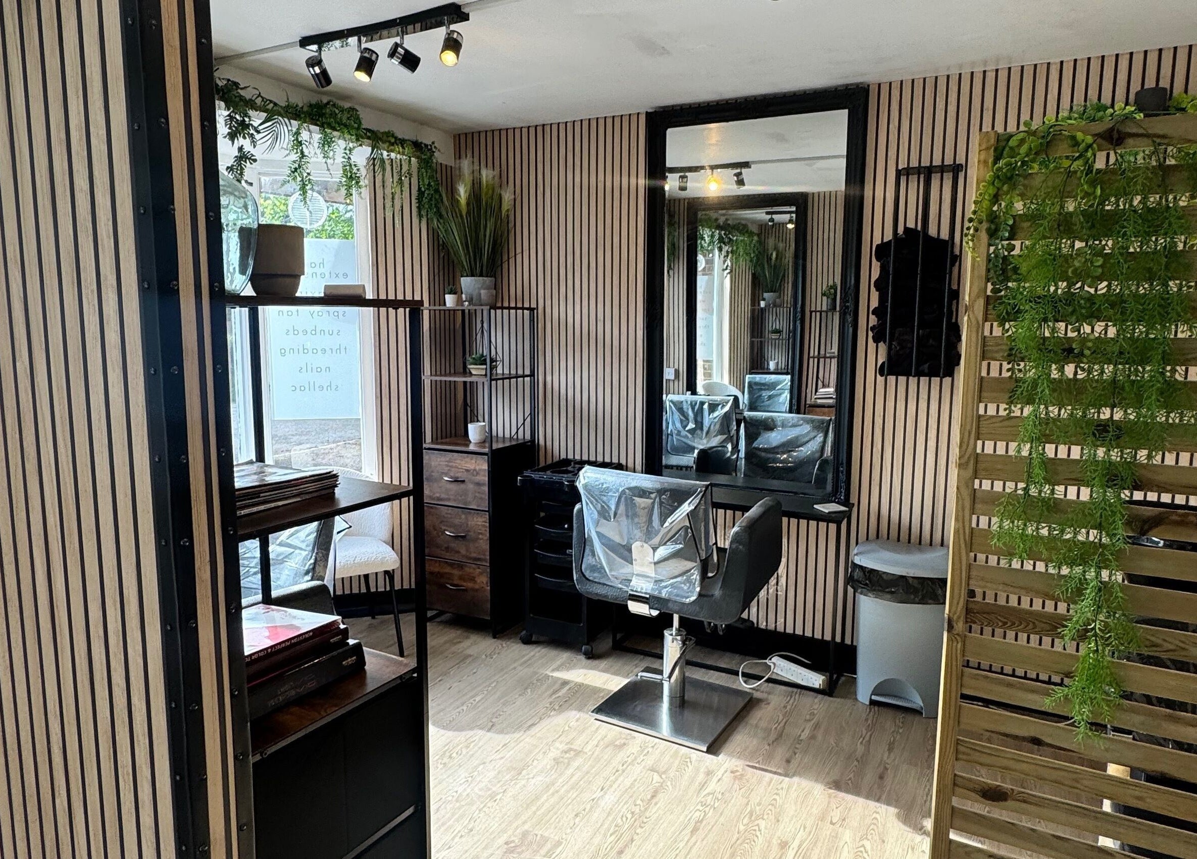 Modern salon interior at Vanity Beauty Naphill, High Wycombe, England, GB with stylish decor and salon chair.