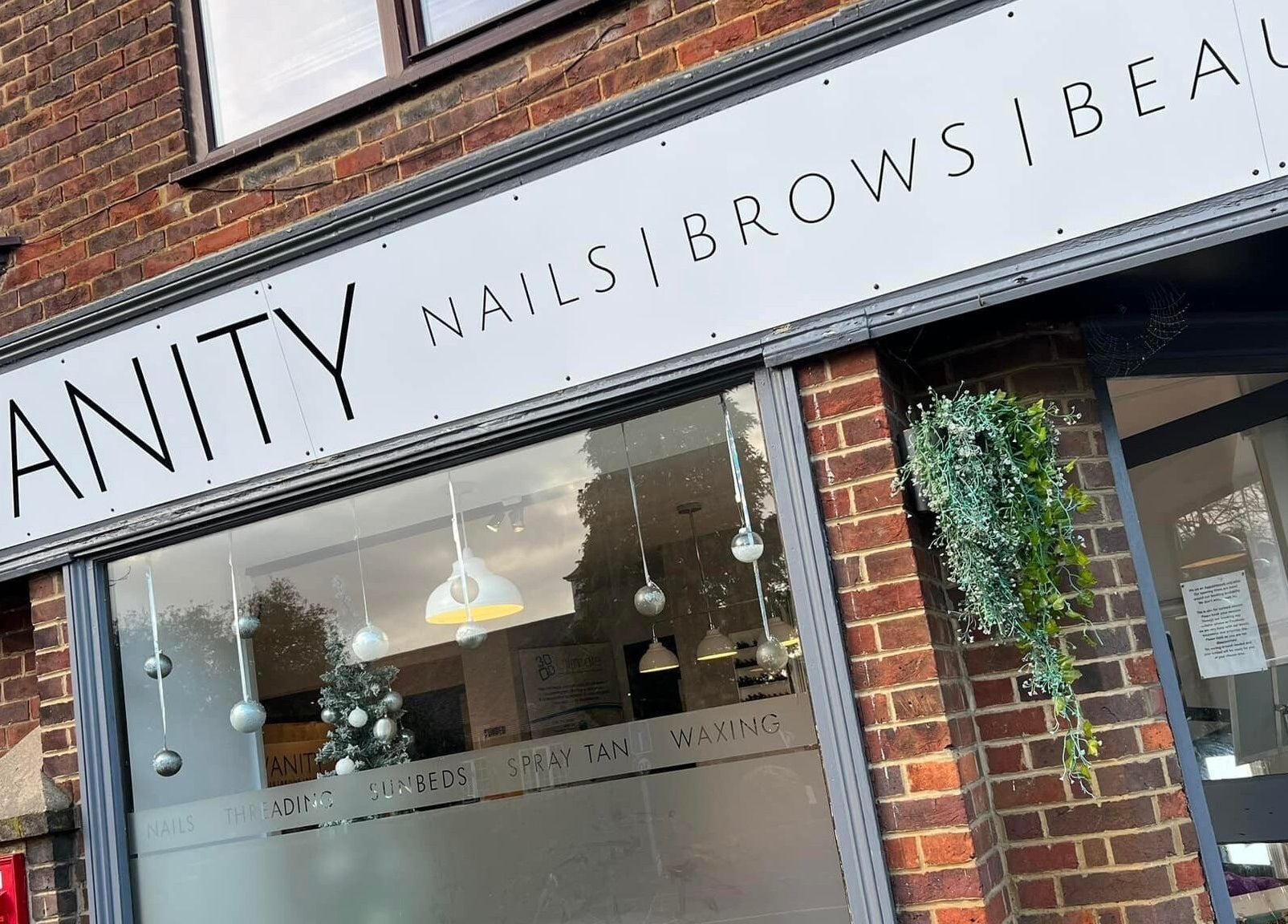 Front signage of Vanity Beauty Naphill in High Wycombe, England, GB, showcasing beauty and wellness services.