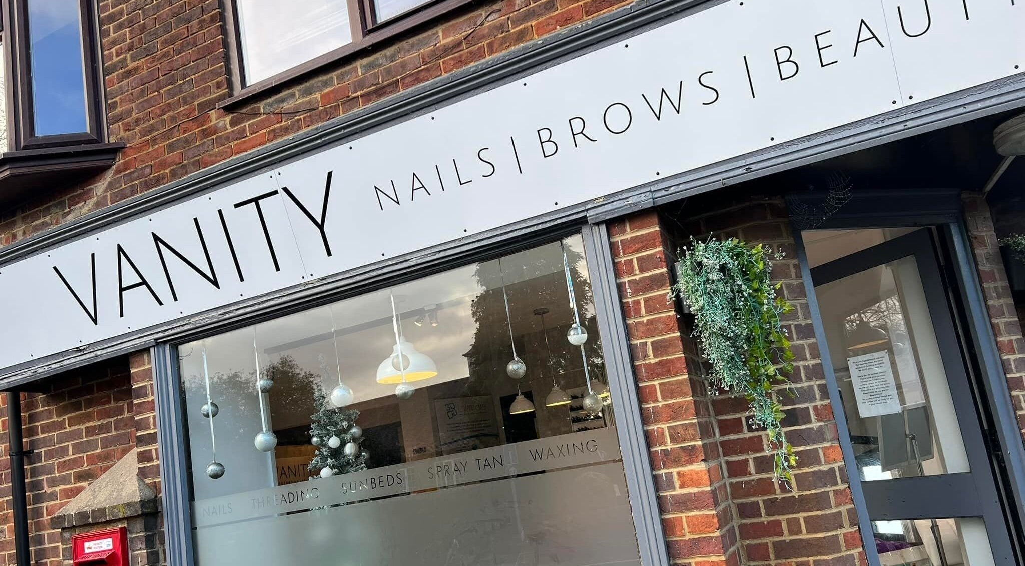 Front signage of Vanity Beauty Naphill in High Wycombe, England, GB, showcasing beauty and wellness services.