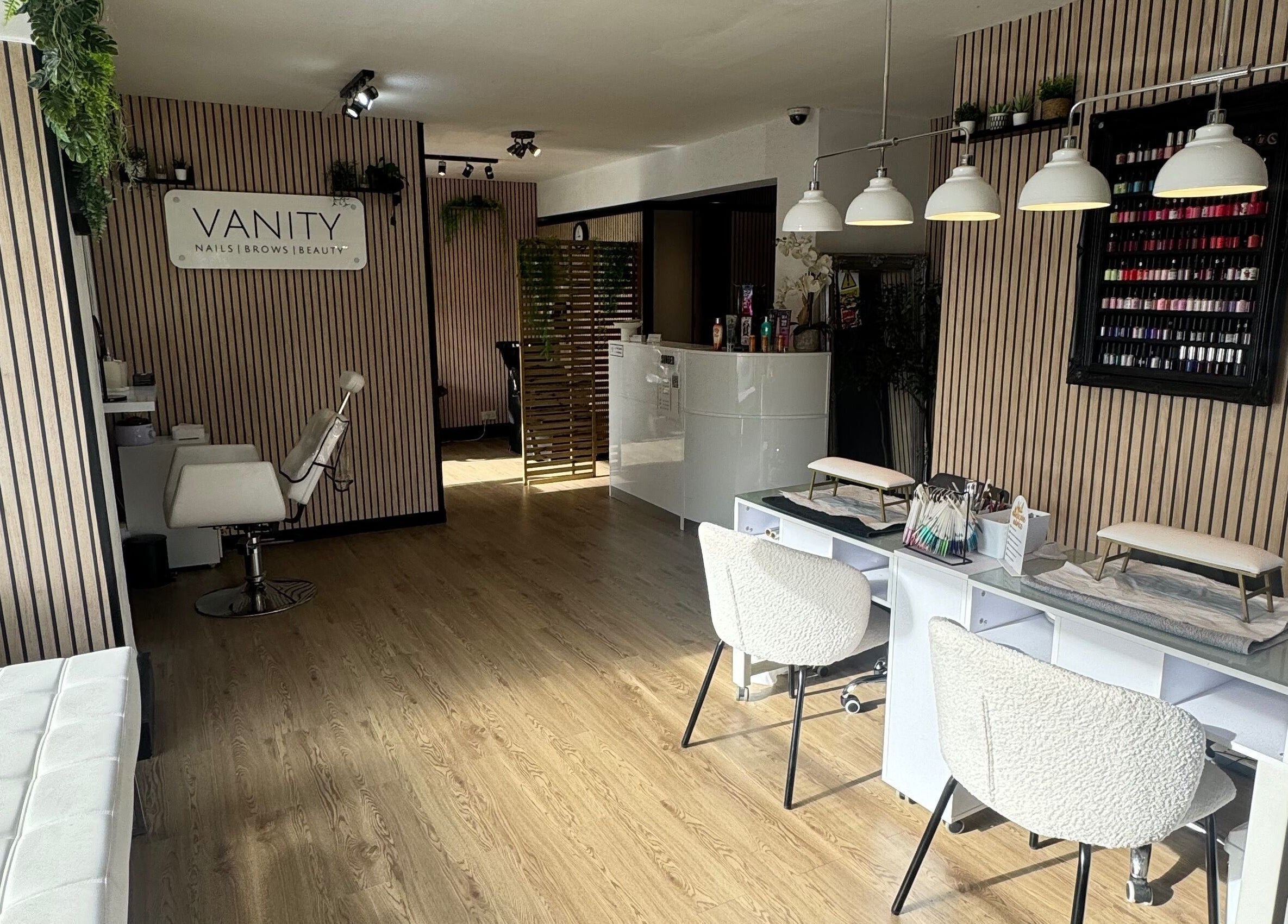 Modern interior of Vanity Beauty Naphill in High Wycombe, England, GB with sleek decor and nail stations.