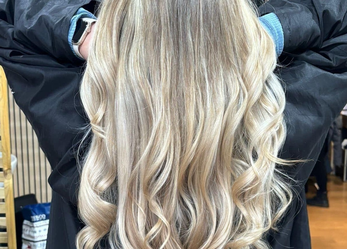 Elegant long blonde curls styled at Vanity Beauty Naphill, High Wycombe, England, GB.