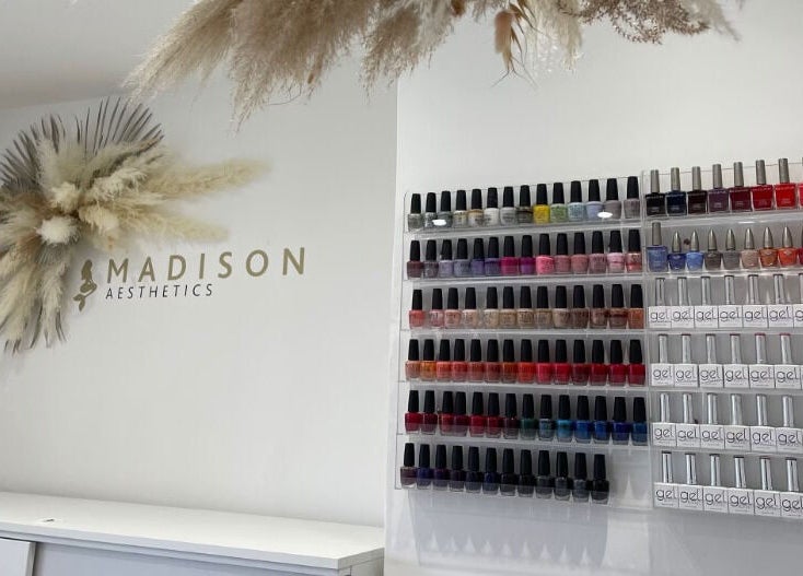 Nail polish display at Madison Aesthetics, Berkhamsted, England, GB with stylish decor.