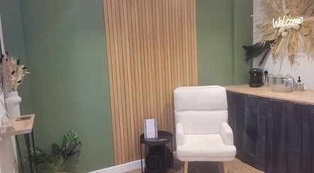 Cozy waiting area in Glam On The Lash, Trimley Saint Mary, England, GB with plush chair and welcoming decor.