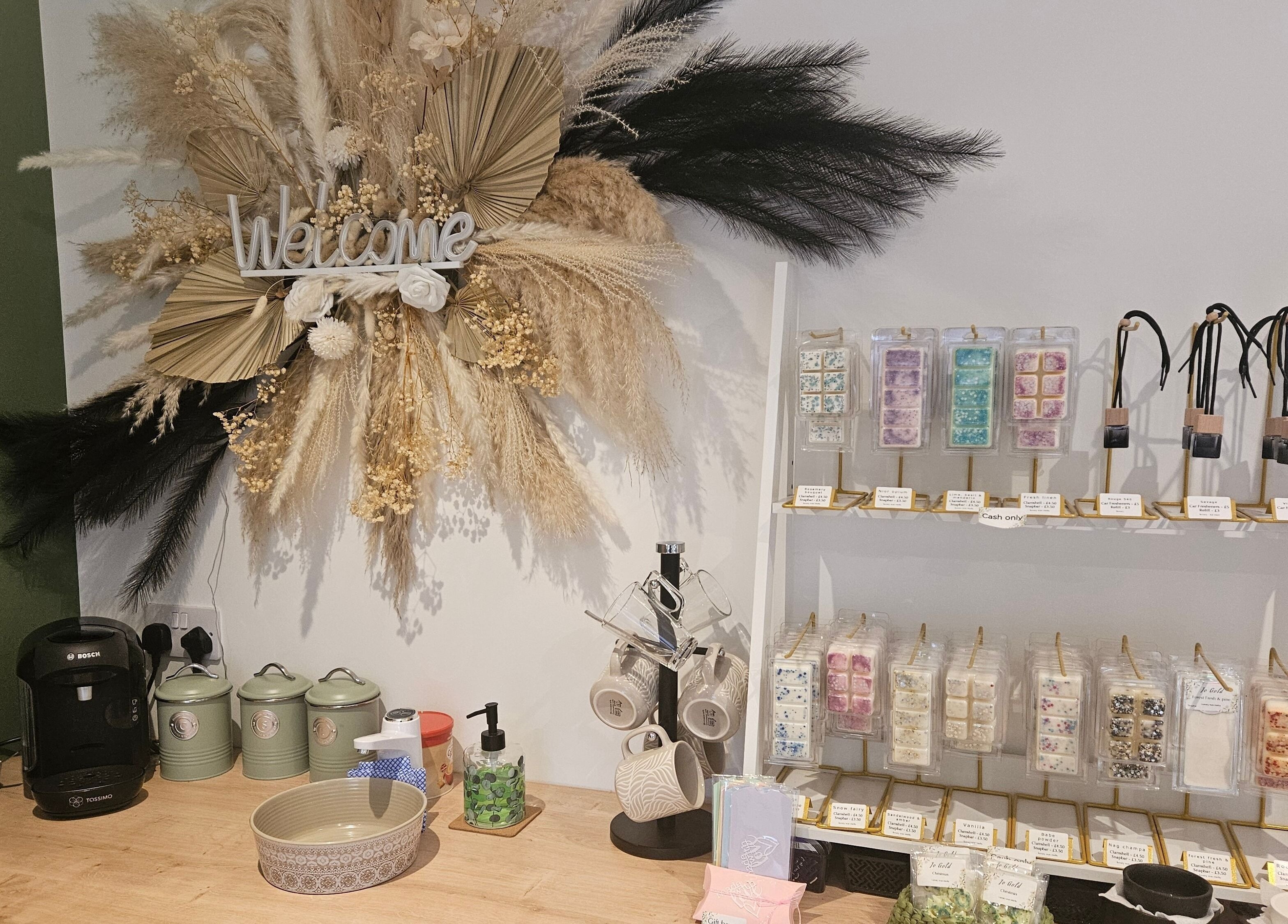 Glam On The Lash reception with decorative display in Trimley Saint Mary, England, GB. Cozy and inviting setup.