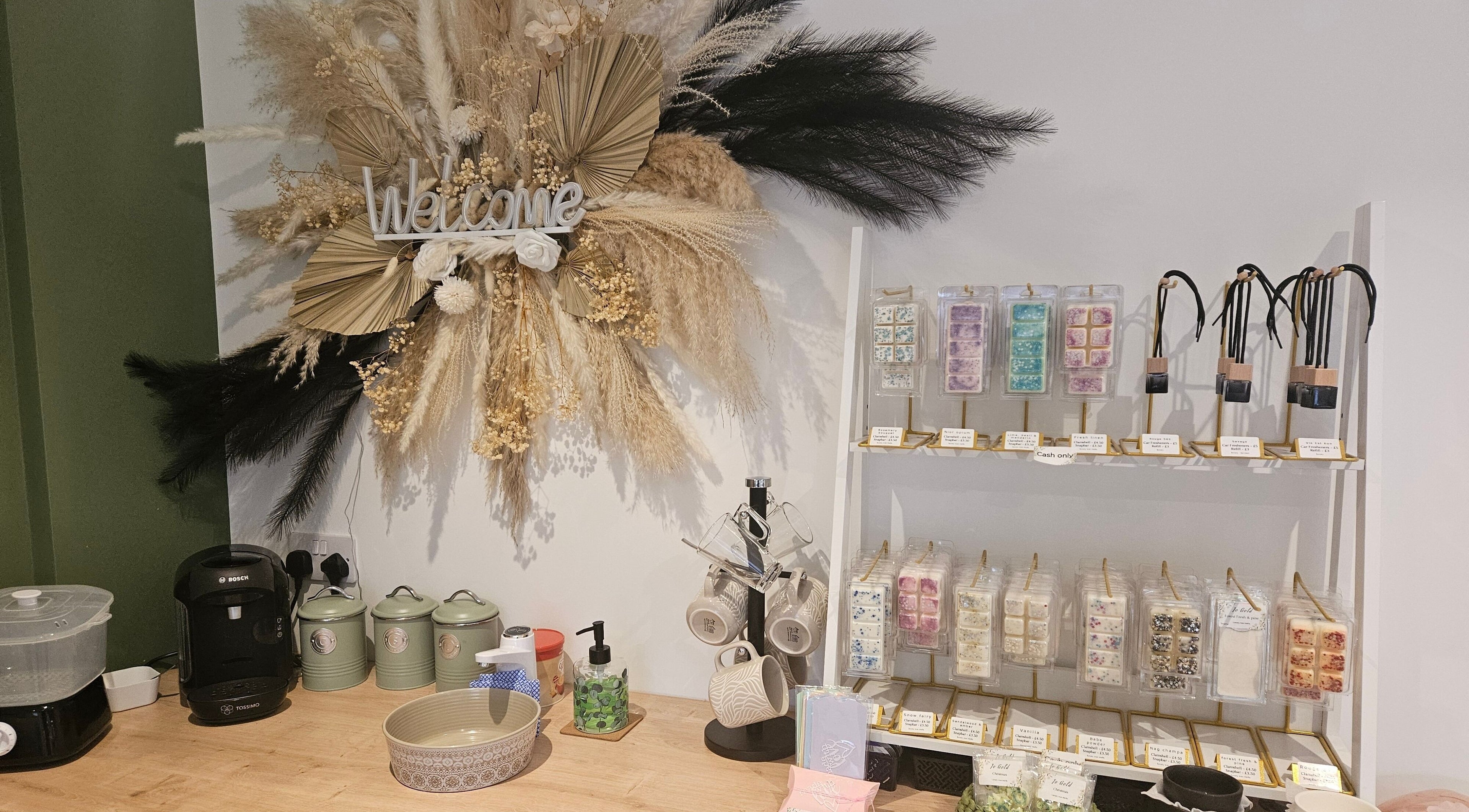 Glam On The Lash reception with decorative display in Trimley Saint Mary, England, GB. Cozy and inviting setup.