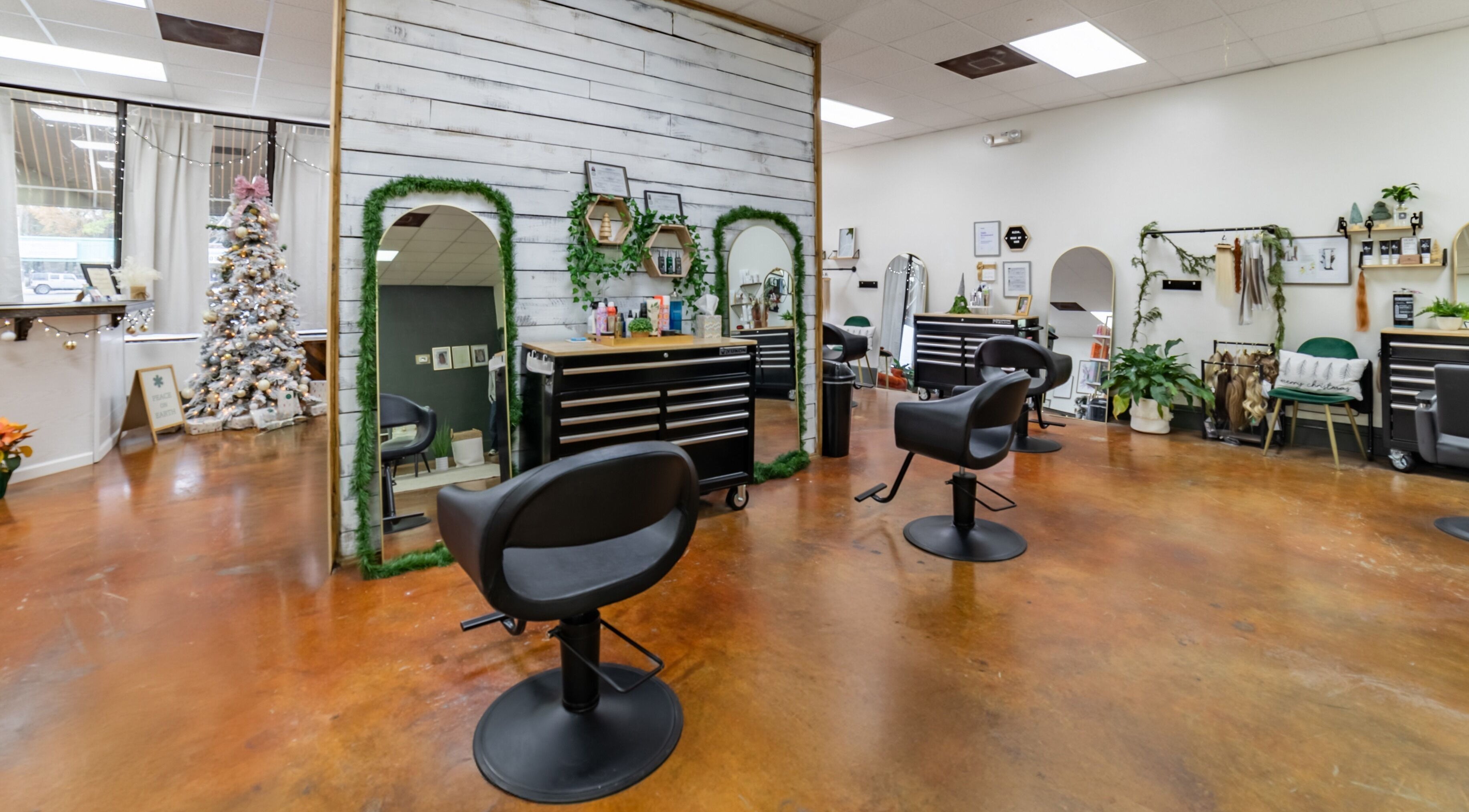 Cozy interior of Luna Jade Salon in Athens, Alabama, US showcasing elegant chairs and festive decor.