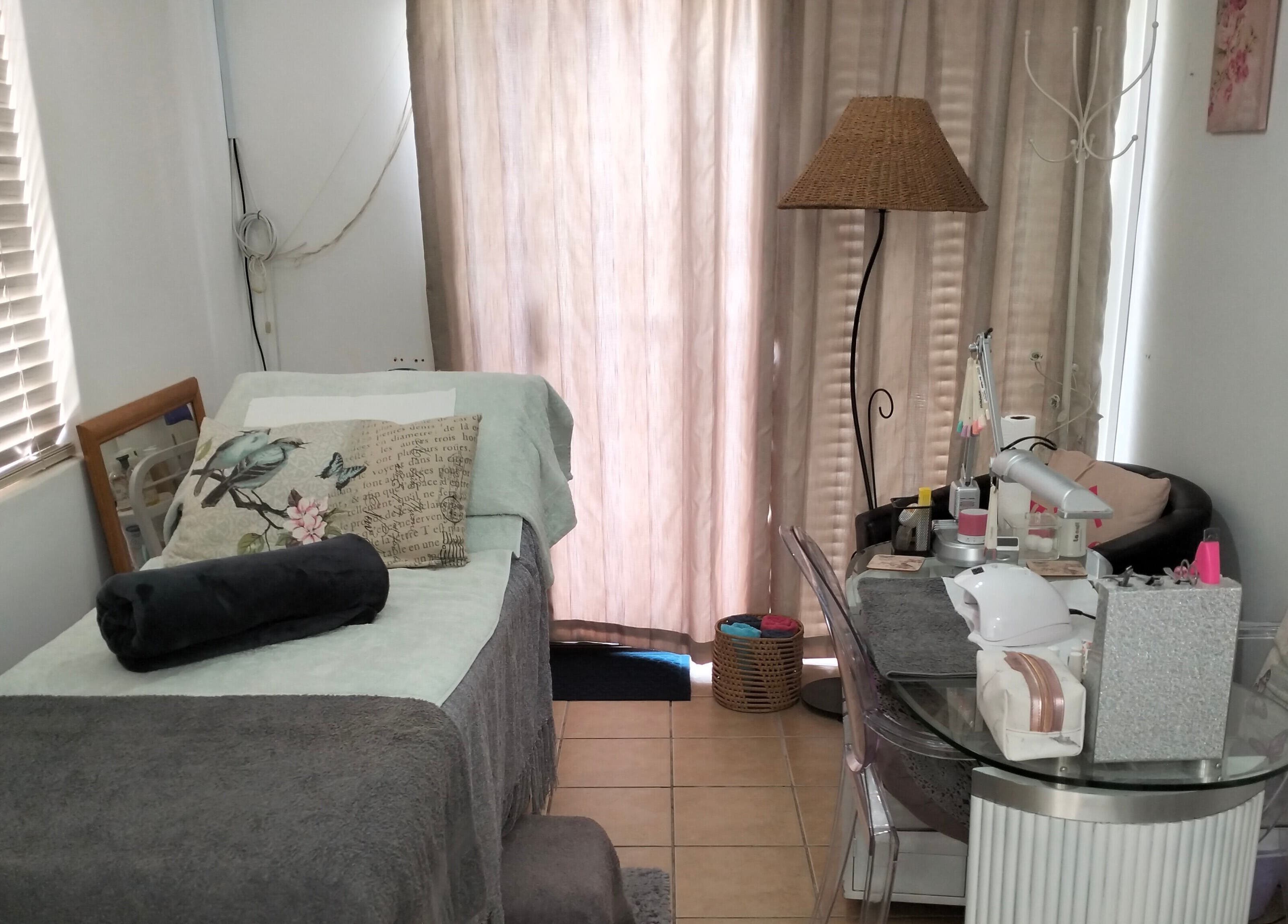 Relaxing treatment room at La Bella Beauty, Cape Town, Western Cape, ZA, featuring a cozy bed and soothing decor.