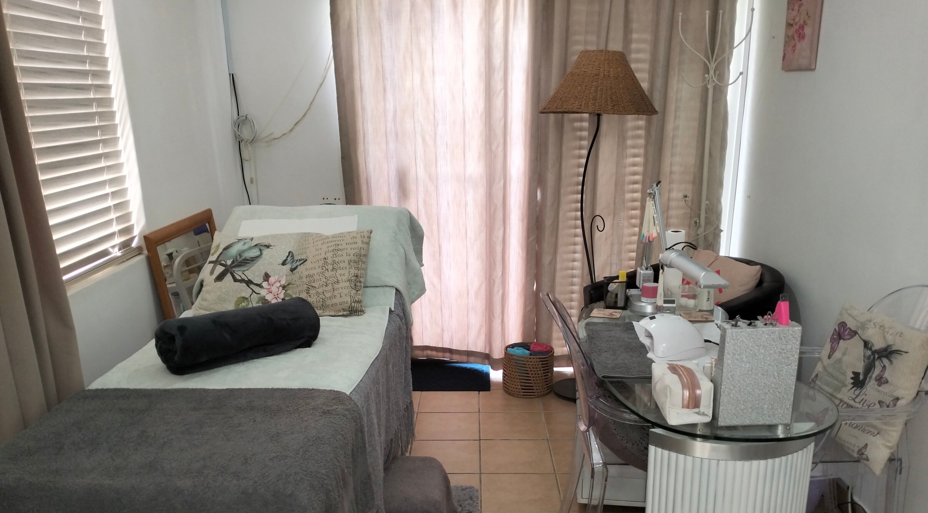 Relaxing treatment room at La Bella Beauty, Cape Town, Western Cape, ZA, featuring a cozy bed and soothing decor.