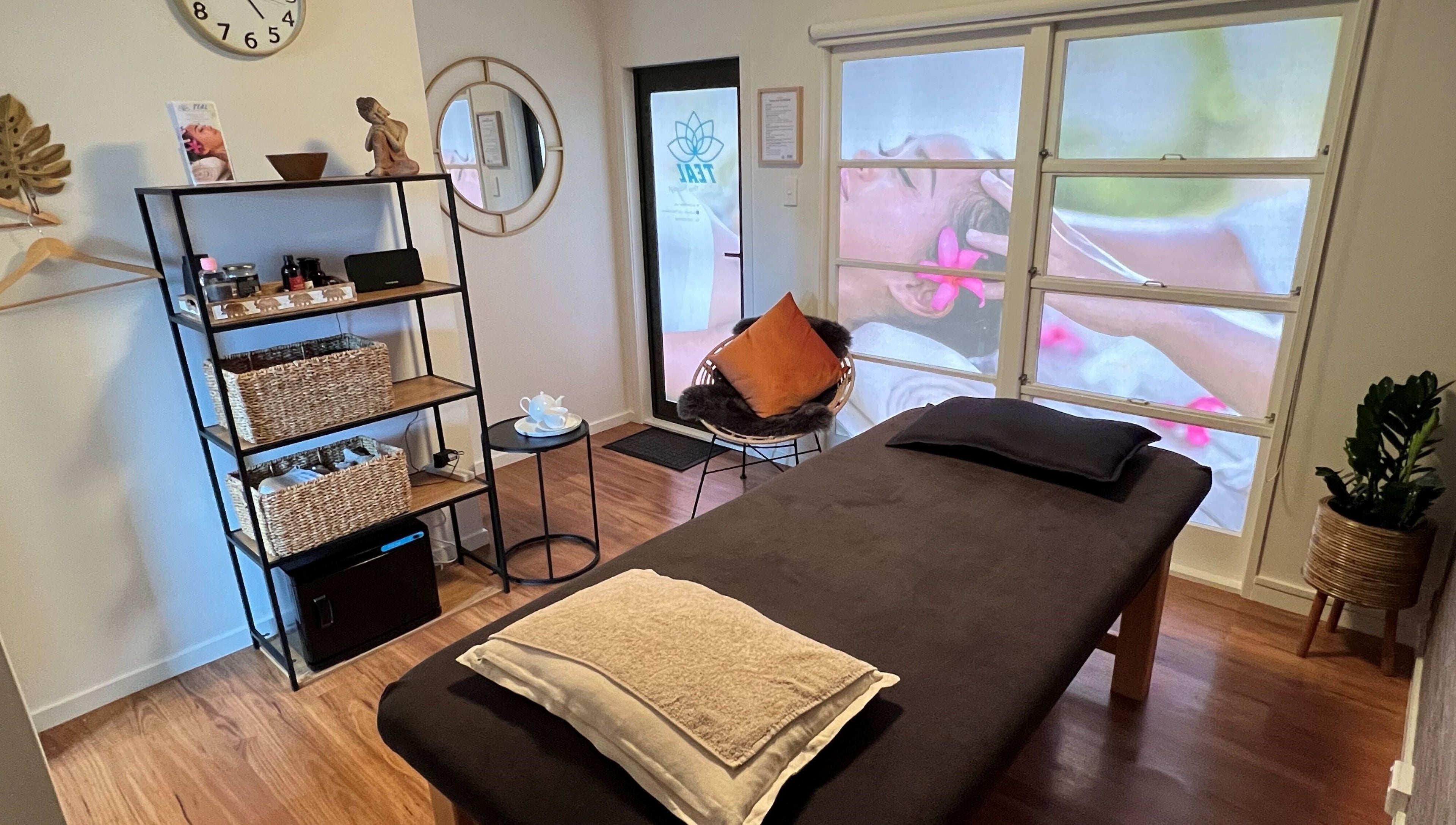 Relaxing massage room at Teal Authentic Thai Massage, Gisborne, NZ, showcasing a tranquil ambiance.