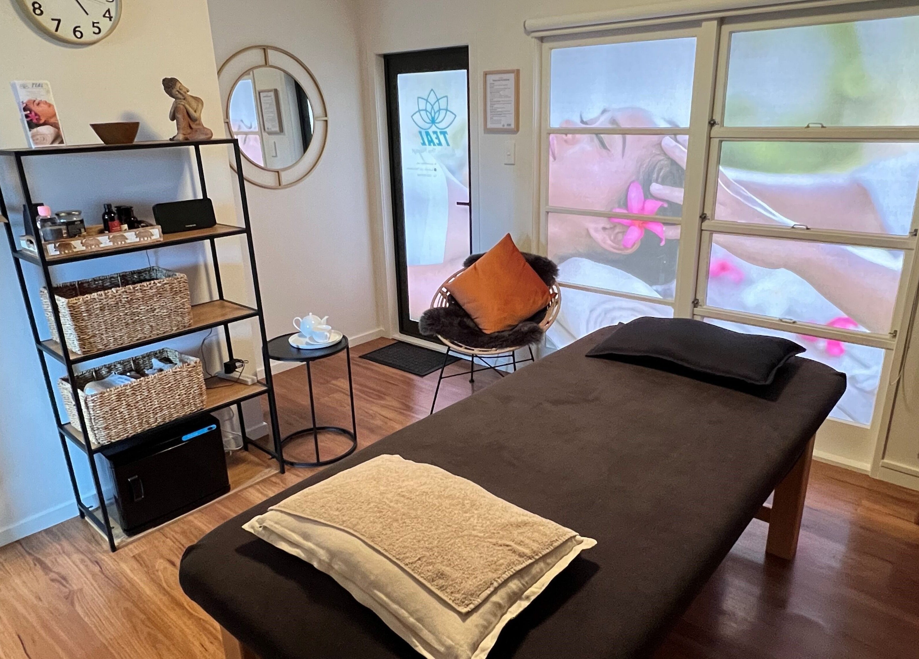Relaxing massage room at Teal Authentic Thai Massage, Gisborne, NZ, showcasing a tranquil ambiance.