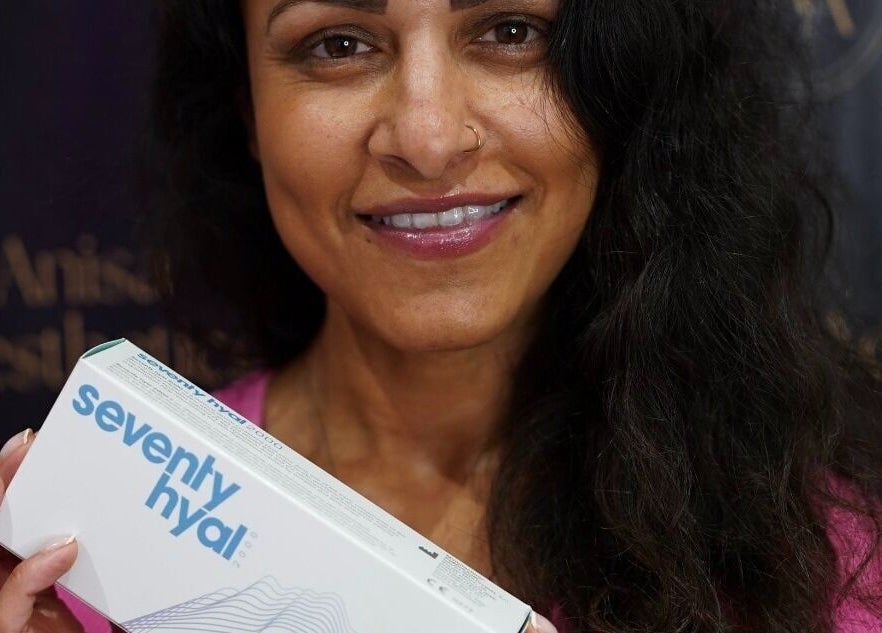 smiling person holding a Seventy Hyal product at Anisa Aesthetics, Peterborough, England, GB